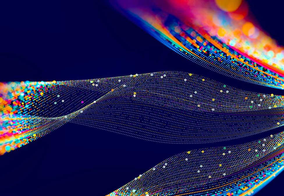 An abstract graphic of various colorful orange and blue mixed swirling lines against a dark blue background. 